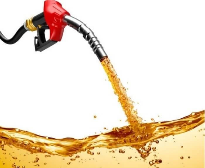 Red gas pump pouring out gasoline filling in the bottom of the picture.